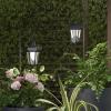 imageSet of 2 Solar Lanterns  Waterproof Hanging Coach LED Lights with Shepherd Hooks for Mounting  Garden Decor for Outside by Pure Garden Black